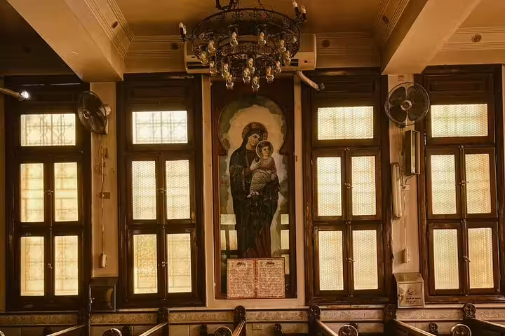 Historic Coptic Cairo church interior with icon and chandeliers, included on private 3-day Cairo Alexandria guided tour