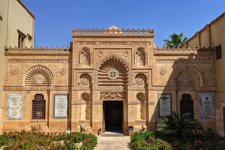 Ornate Coptic Cairo monastery facade with carved stonework, stop on private Cave Church tour and Cairo felucca ride