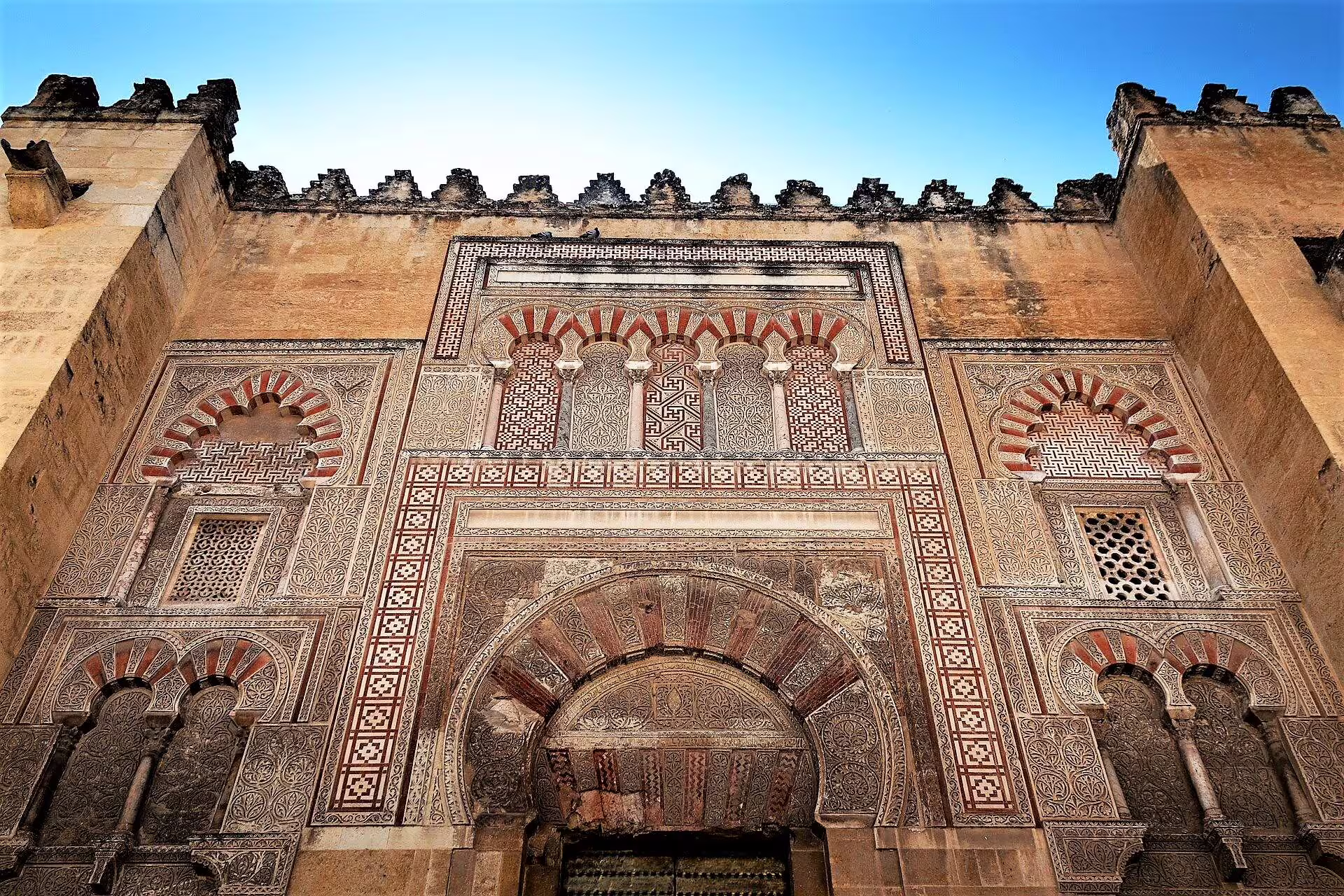 Ornate horseshoe-arch entrance of Córdoba’s Mezquita Mosque-Cathedral, featured on a private walking tour