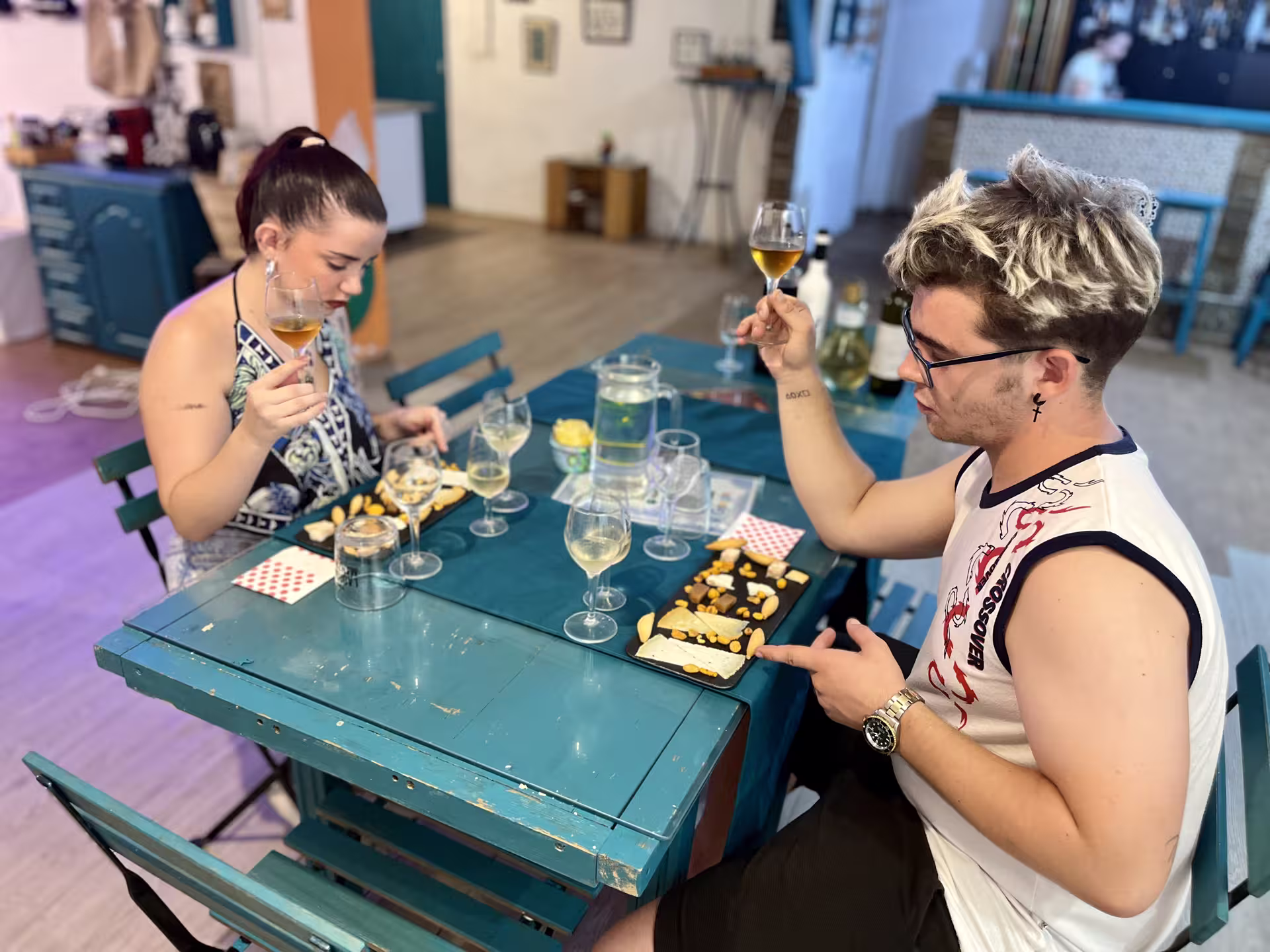 Participants savor wine and traditional snacks at a Cordoba tasting session, highlighting local flavors.