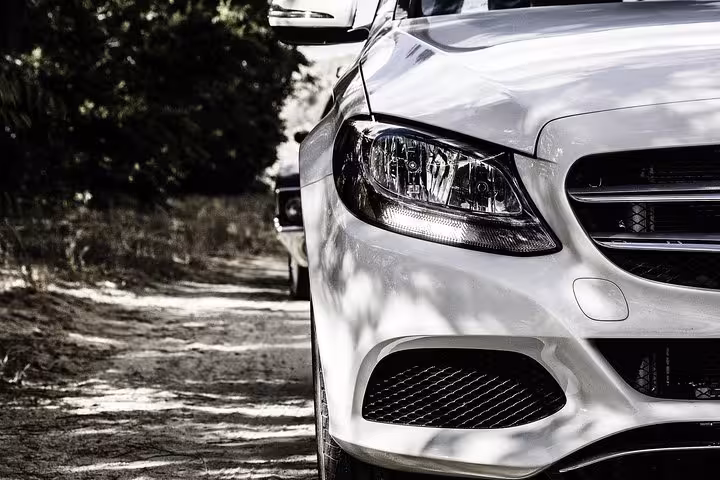 White luxury sedan for Corfu Airport to Acharavi private transfer, premium vehicle for smooth island travel
