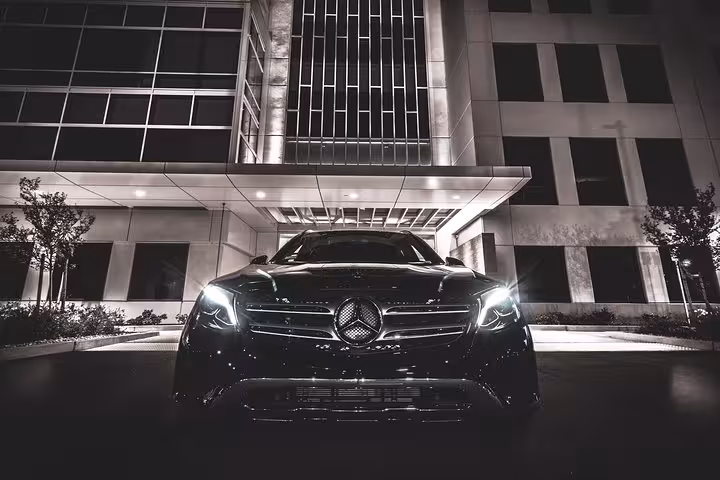 Luxury Mercedes sedan at night for CFU Corfu Airport to Roda private transfer, private chauffeur pickup