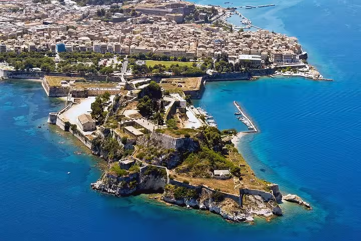 Aerial view of Corfu Old Fortress and coastline with turquoise sea, featured on a private Corfu tour itinerary