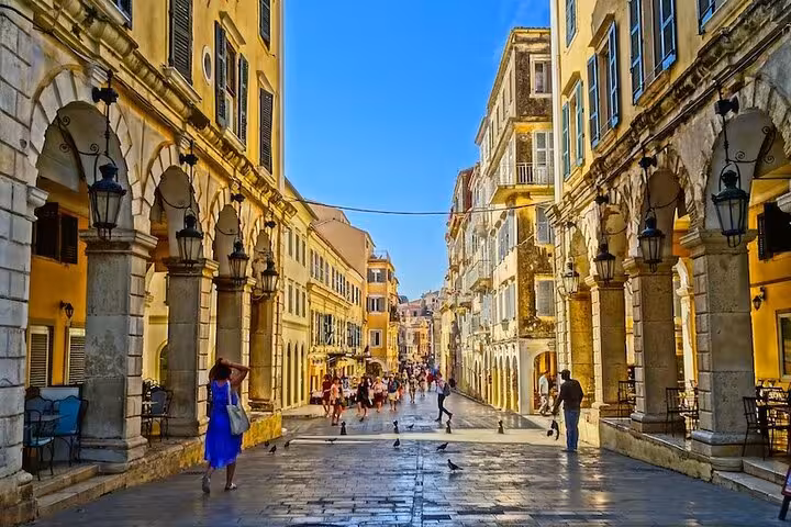 Old Town Corfu street with Venetian arcades and lanterns, explored on Corfu in a Day private tour