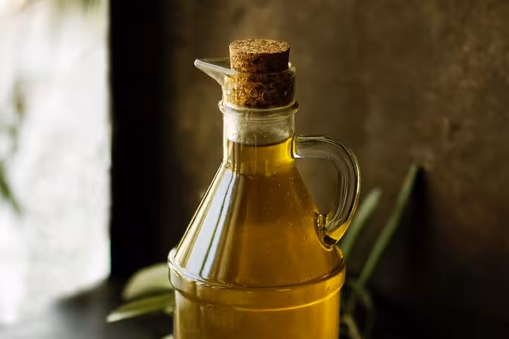 Glass bottle of Corfu olive oil for local tastings, featured on the private tour to Corfu Town and Palaiokastritsa
