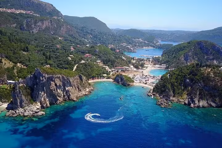 Drone view of Corfu Paleokastritsa bay with cliffs and crystal water, ideal for private beauty and beach tour