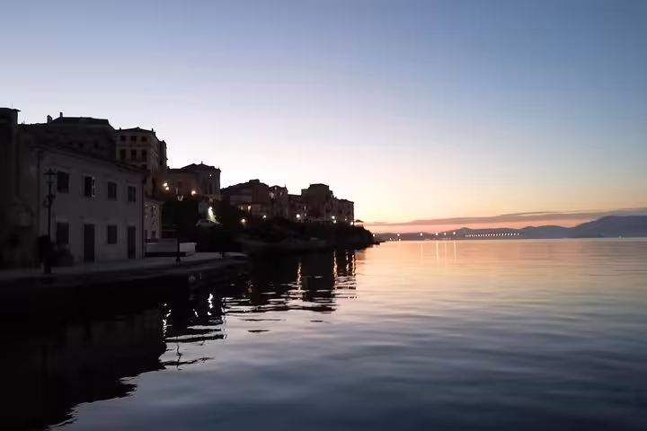 Sunset waterfront in Corfu Old Town on the Ionian Sea, scenic stop on local BBQ boat trip cruise