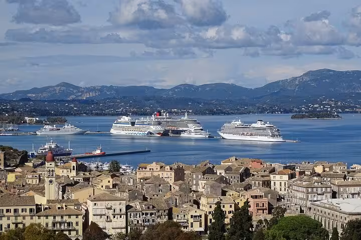 Panoramic Corfu Town rooftops with cruise ships in the Ionian Sea on a 4-hour small group tour