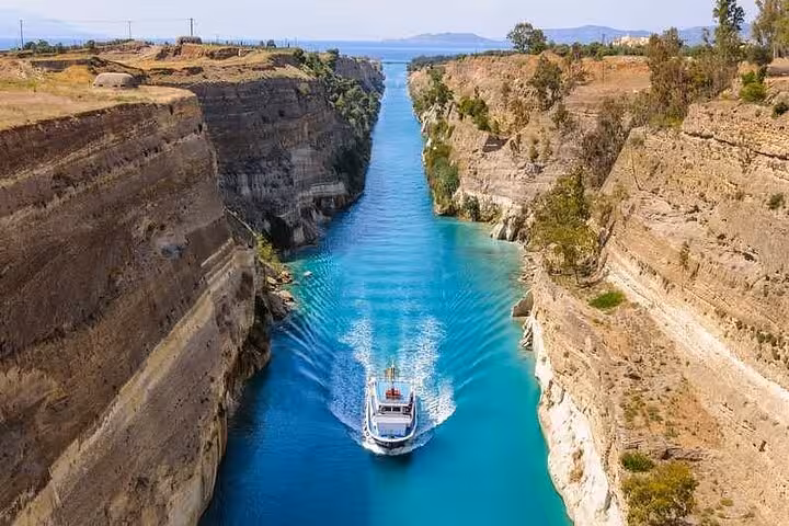 Boat cruising the Corinth Canal near Ancient Corinth, scenic stop on Athens and Biblical Corinth full-day private tour