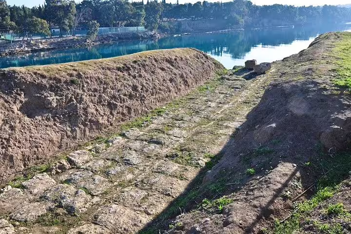 Stone path beside the Corinth Canal, scenic stop on Athens Highlights & Ancient Corinth private full-day tour