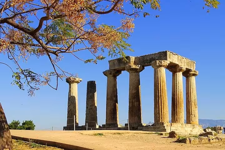 Ancient Corinth Temple of Apollo ruins on Athens day trip via Corinth Canal with wine tasting and pottery workshop