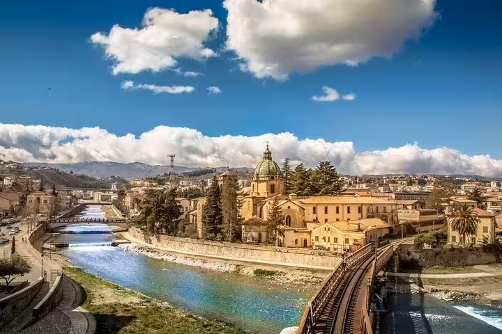 Panoramic view of Cosenza skyline, river and bridges showcasing art, architecture and landscapes on a private tour