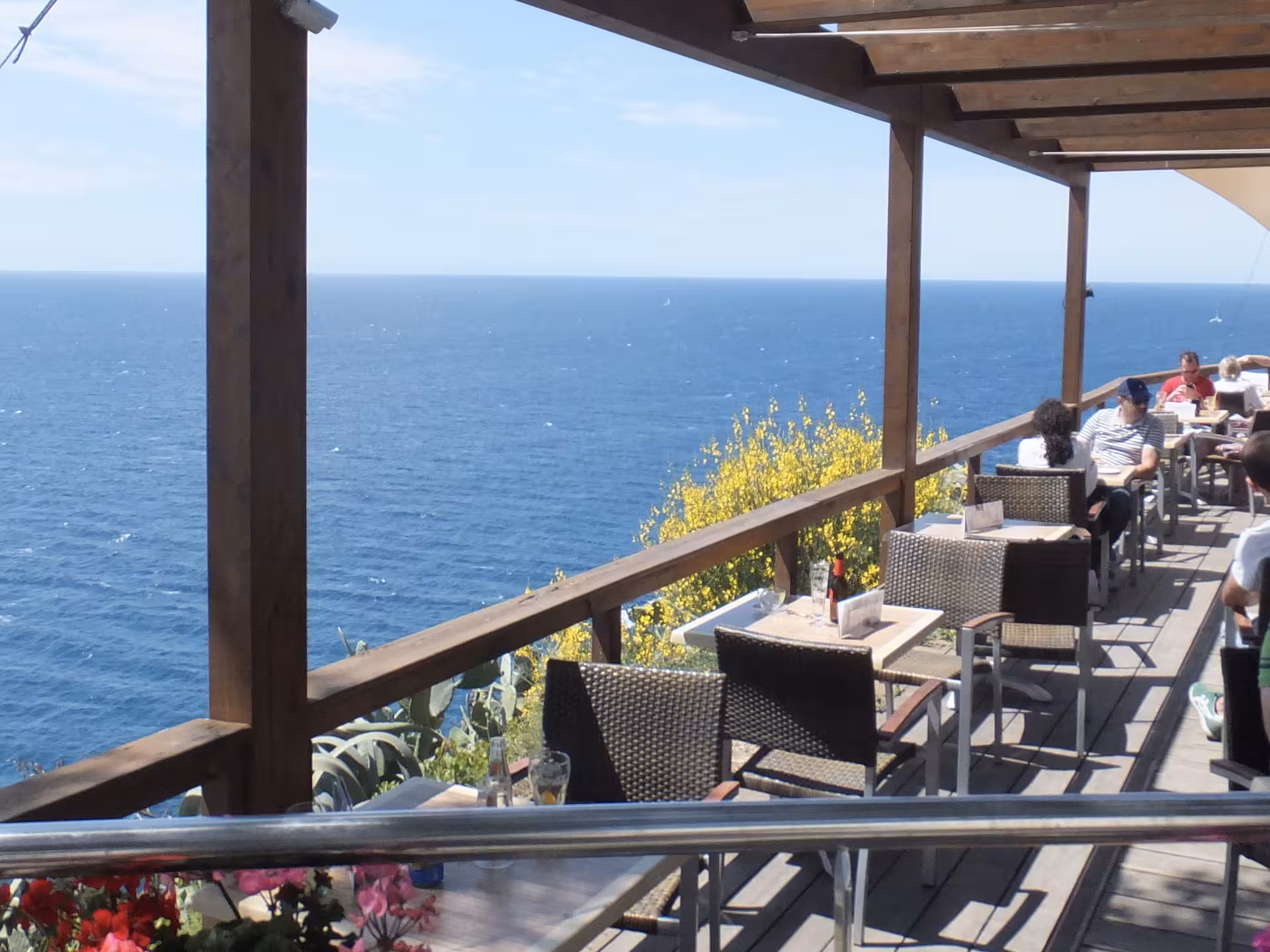 Seafront terrace café overlooking the Mediterranean on a Costa Brava beach trip from Barcelona