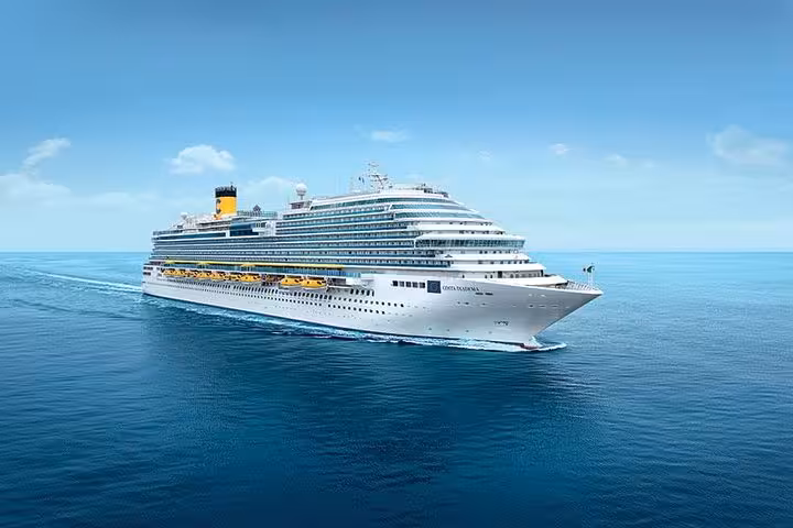 Large Costa cruise ship sailing on calm blue Mediterranean waters under clear sky