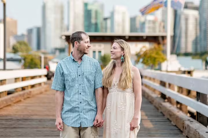 Couple walking on a Berlin riverside pier during private vacation photoshoot with local travel photographer