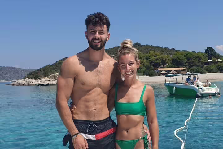 Couple smiling on boat in clear Adriatic at Stiniva Cove stop on Blue Cave & 5 Islands tour from Split