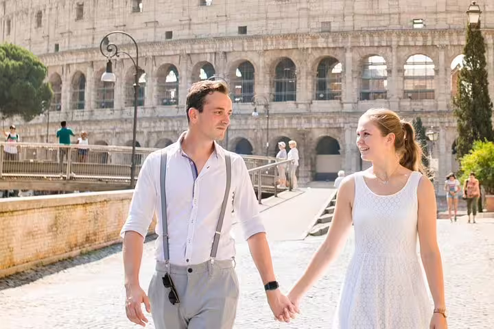 Couple holding hands near the Colosseum during a private Rome travel photographer session, 3-hour photoshoot
