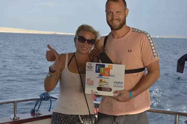 Happy couple on Hurghada boat trip after Dolphin House swim with dolphins and lunch, enjoying Red Sea views