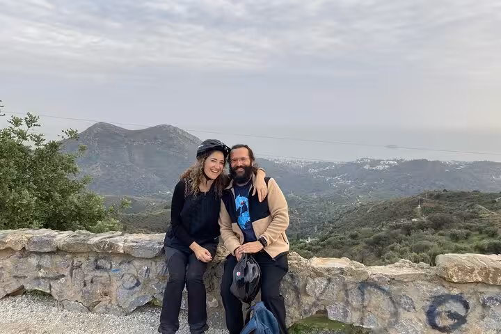 Couple at Montes de Málaga viewpoint after e-fat bike tour, overlooking mountains and the Costa del Sol
