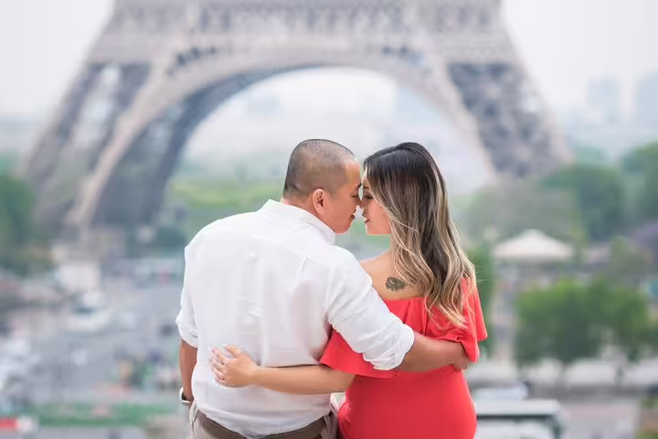 Couple embracing near Eiffel Tower during private Paris photoshoot tour