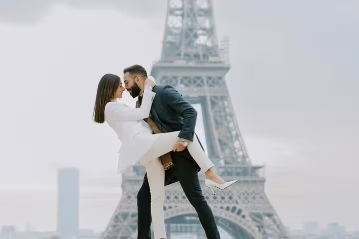 Couple embracing in front of the Eiffel Tower in Paris