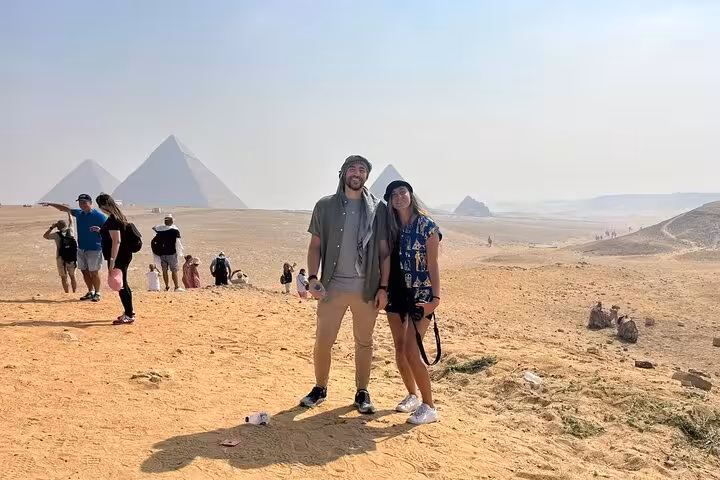 Couple photo with panoramic Giza Pyramids view, ideal for VIP Giza Pyramids Wonders and Grand Egyptian Museum trip