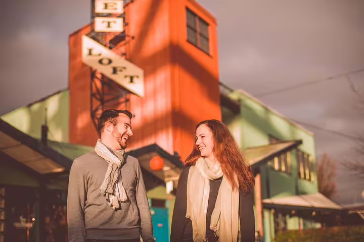 Couple laughing outside Granville Island Public Market, Vancouver personal travel photographer walking tour