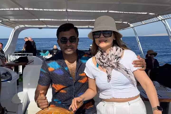 Couple posing on boat to Hula Hula Island, Hurghada Red Sea cruise with lunch and water sports adventure