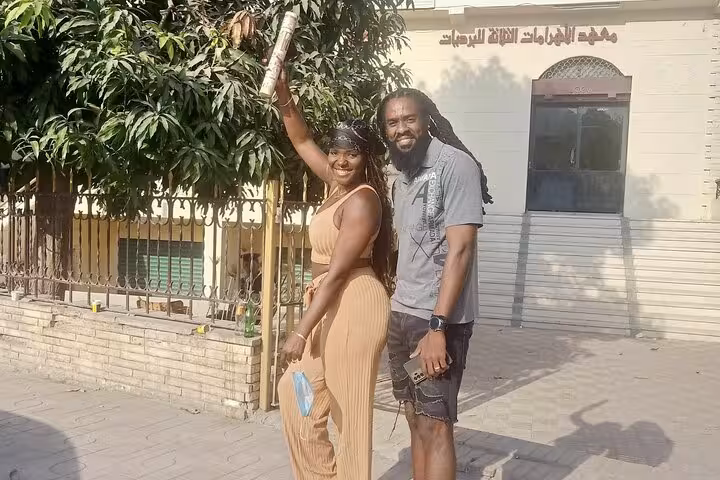 Couple posing in Cairo before Khan el Khalili bazaar shopping and koshary lunch experience in Islamic Cairo