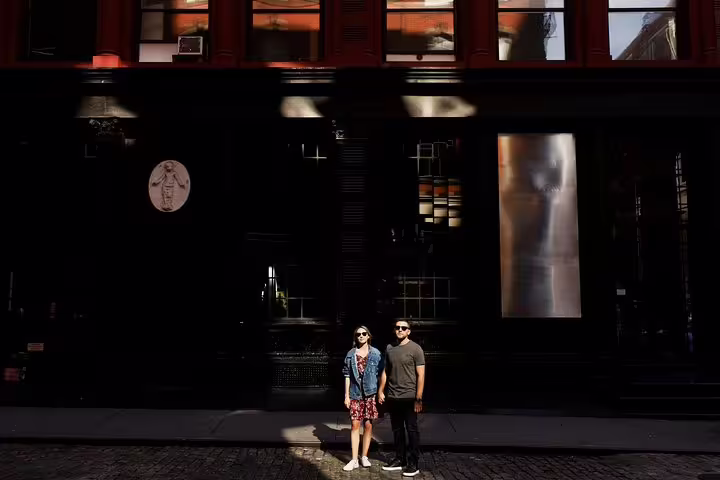 Couple posing in Melbourne CBD street light for a private personal travel photographer tour and lifestyle photoshoot