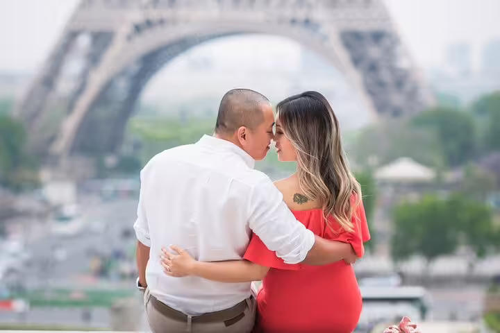 Couple embracing near Eiffel Tower during private Paris photoshoot session