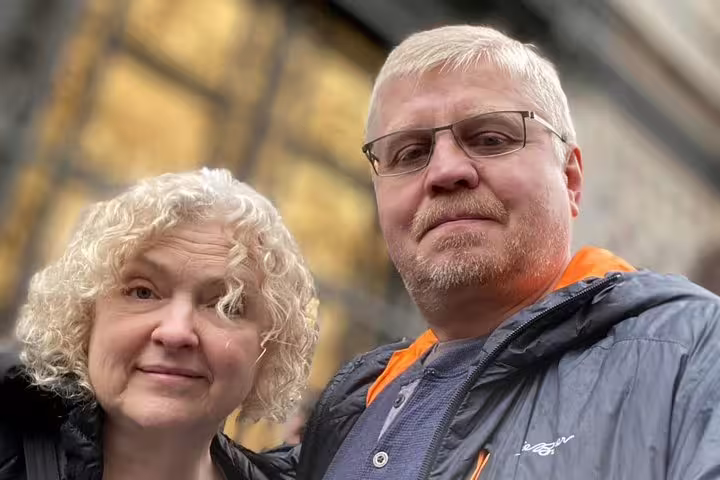 Couple posing together outdoors near historic Florence architecture on walking tour