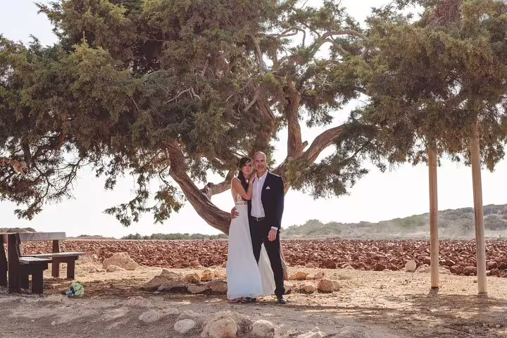 Couple posing under a tree during a private photoshoot in Ayia Napa's scenic landscape.