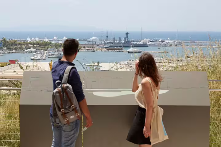 Couple viewing Piraeus marina from a lookout, a scenic stop on a private half-day Athens sightseeing tour