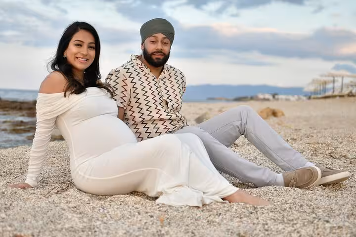 Couple relaxing on Hersonissos beach, capturing a serene moment in a private photoshoot.