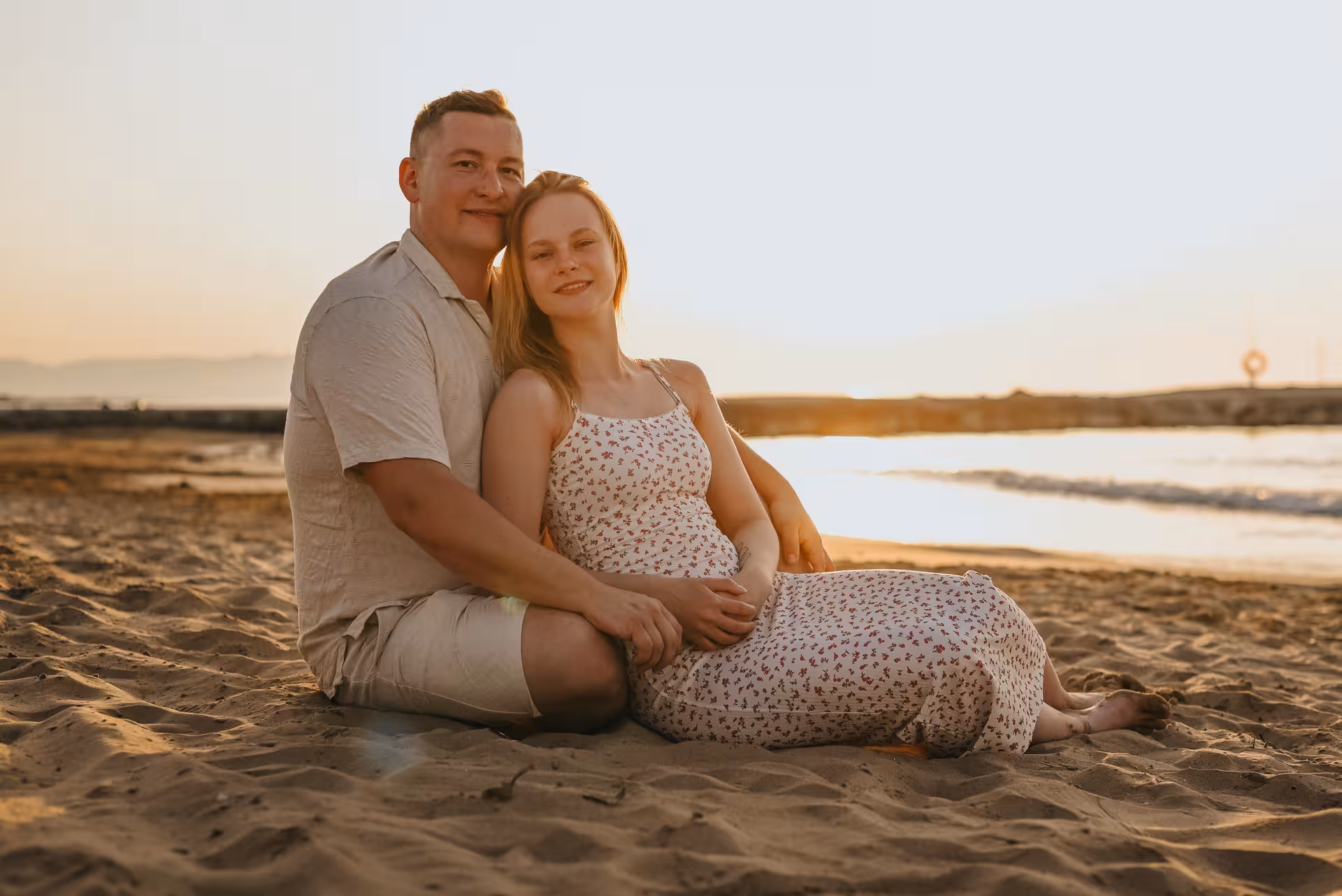 Couple enjoying a romantic sunset on Gouves beach during a private photoshoot experience.