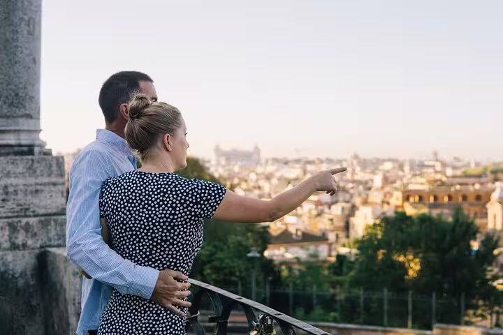 Couple at Rome viewpoint pointing over skyline during private 3-hour travel photographer photoshoot