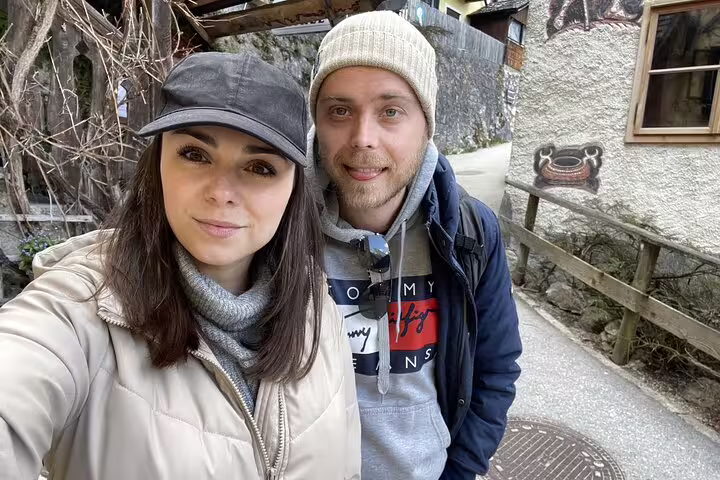 Couple taking a selfie outdoors during Hallstatt guided tour escape game treasure hunt