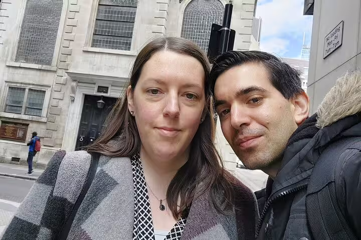 Couple taking a selfie on a London street during a self-guided walking tour