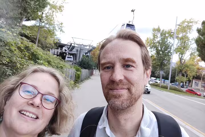 Couple taking a selfie near Montjuic cable car station in Barcelona