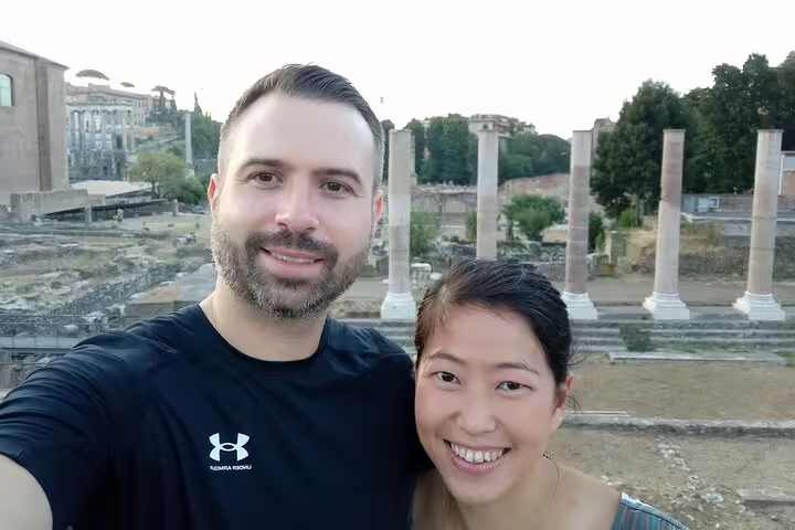 Couple taking a selfie at the Roman Forum ruins during a self-guided walking tour of Ancient Rome