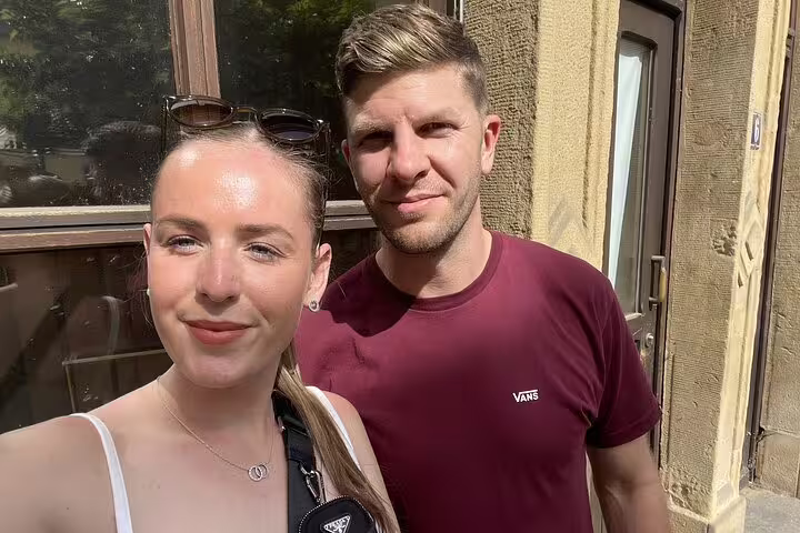 Couple taking a selfie outdoors in Luxembourg City on a sunny day