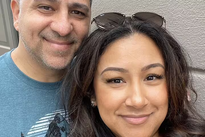 Smiling couple posing together for a selfie outdoors