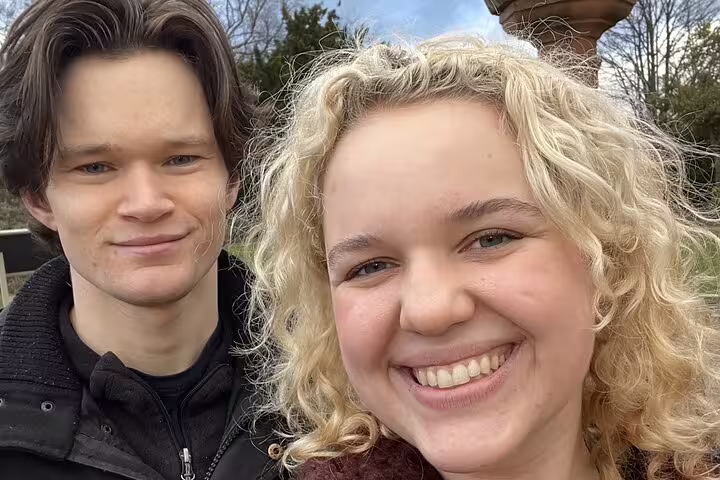 Happy couple smiling together outdoors on a romantic Edinburgh escape game tour