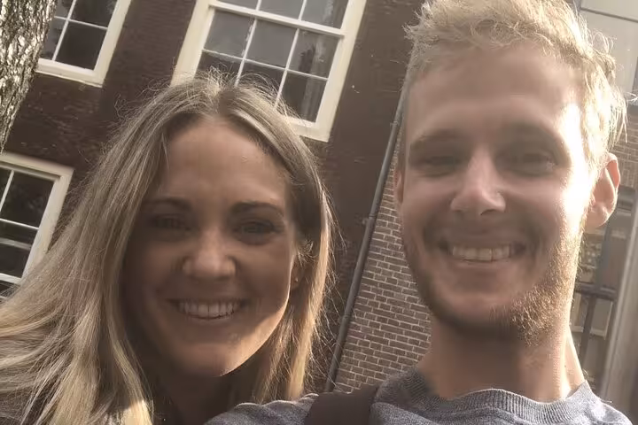 Smiling couple enjoying a self-guided walking tour in Delft city center