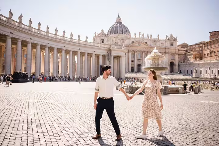 Couple holding hands in St Peter’s Square, Vatican City, during private Rome travel photographer session