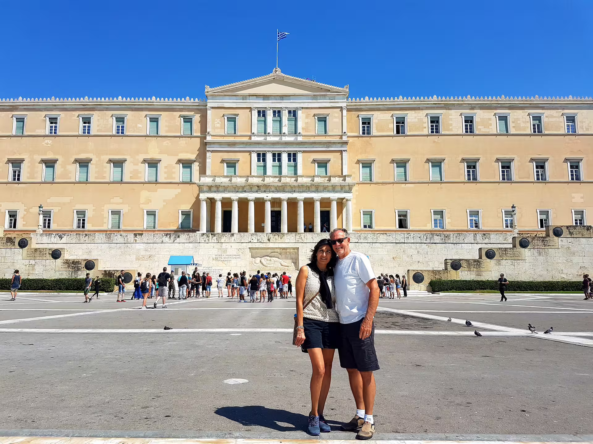 Couple posing at Syntagma Square by the Hellenic Parliament, stop on Athens classical full day private tour