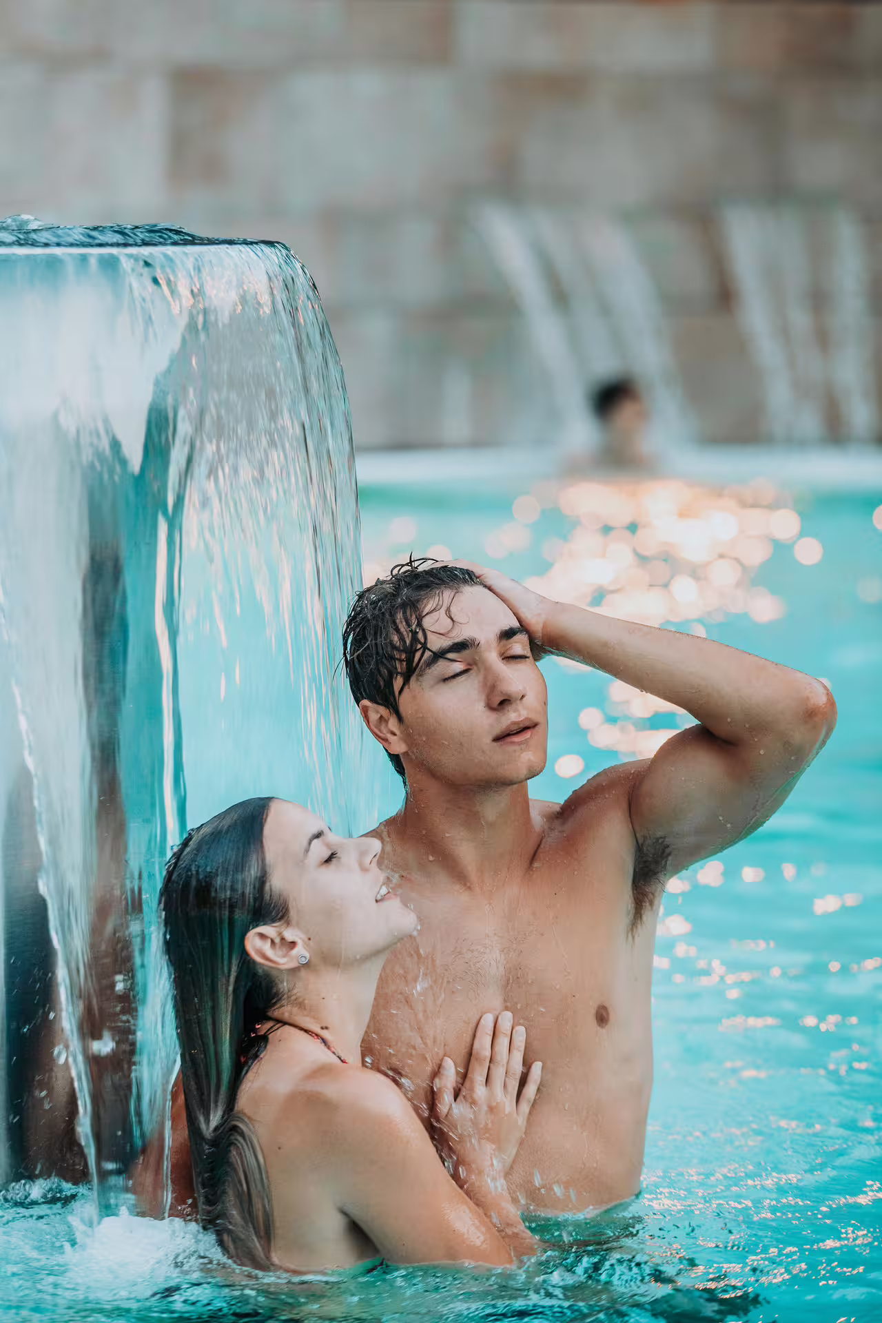Couple relaxing under waterfall jets at Bagno di Romagna thermal spa, 25-min massage, aperitif and pool entry