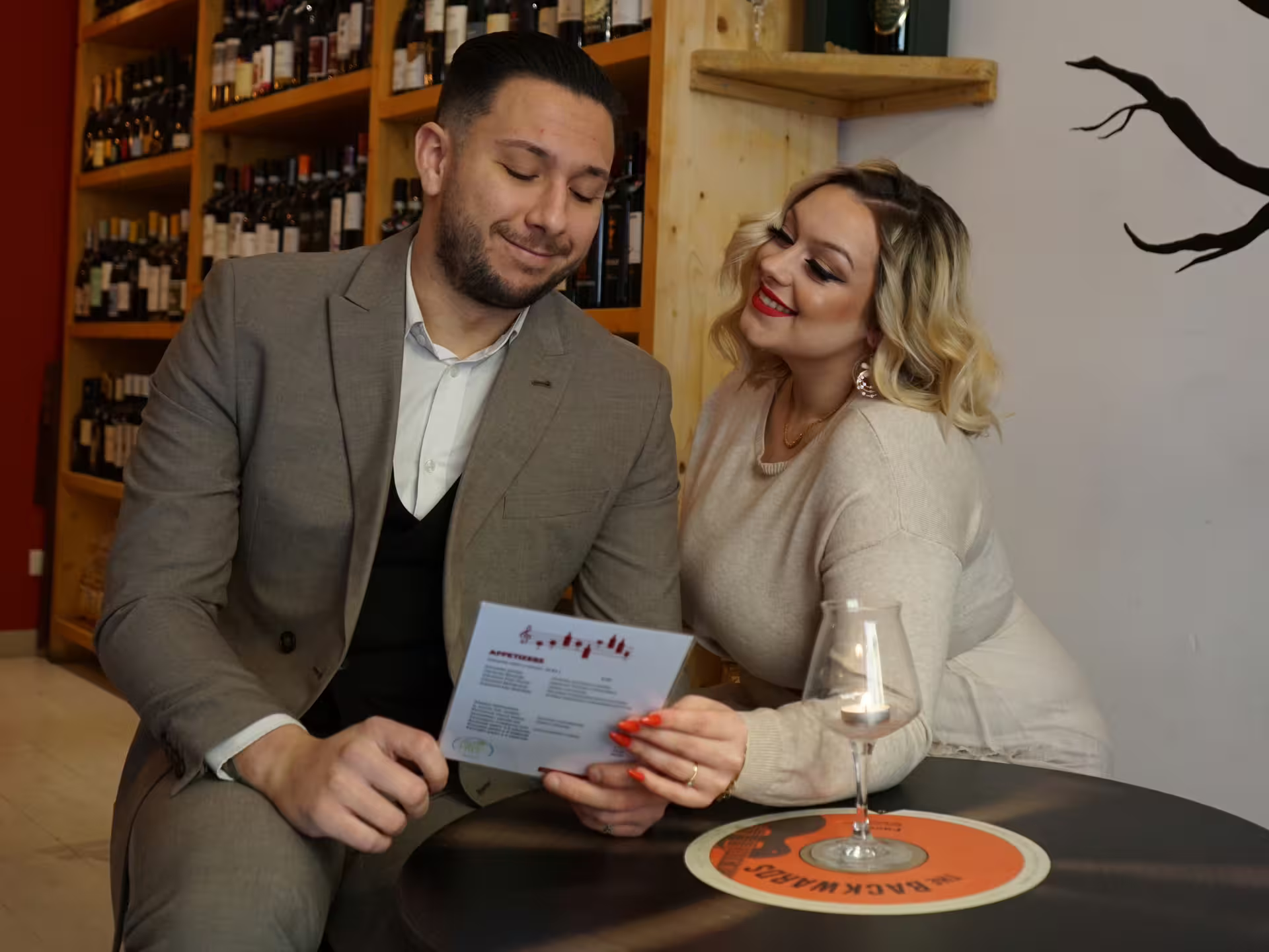 Couple reviewing tasting notes at a Turin city center wine bar during an easy guided wine tasting experience
