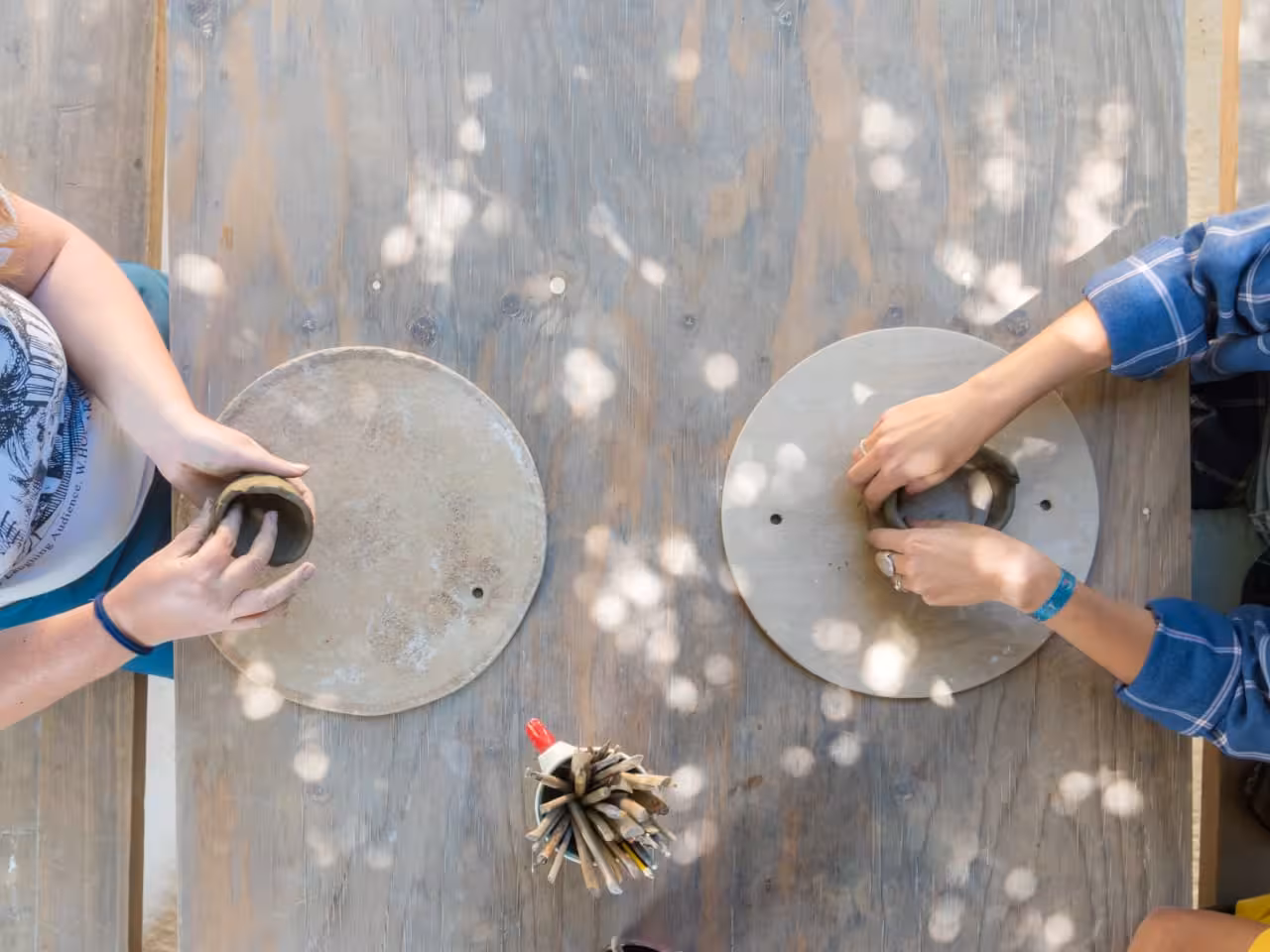 Hands shaping clay at a Cretan pottery workshop, authentic craft experience on the Crete culture day trip